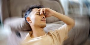 Man experiencing dizziness due to sinus problems